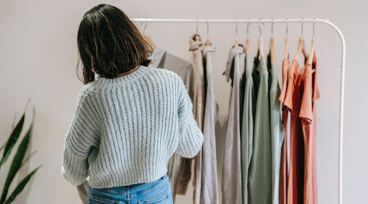 woman looking at clothes rack