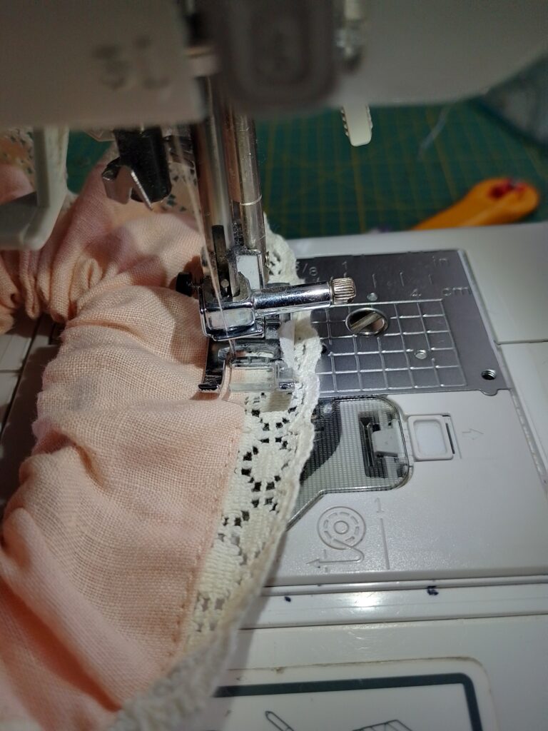 Image of scrunchie being topstitched near the lace