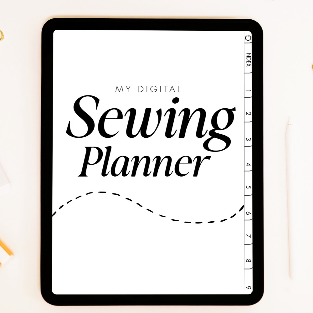 A close-up, top-down view of a tablet displaying the cover of the "My Digital Sewing Planner" on a clean, light-colored surface with a stylus and stationery items out of focus in the background.