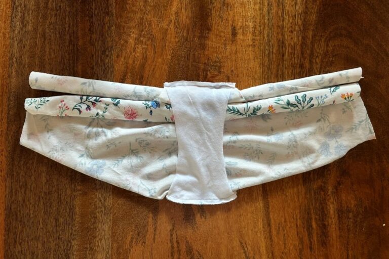 Panties pattern being sewed together using the burrito method for enclosed seams. The font and back pieces are rolled together at the center