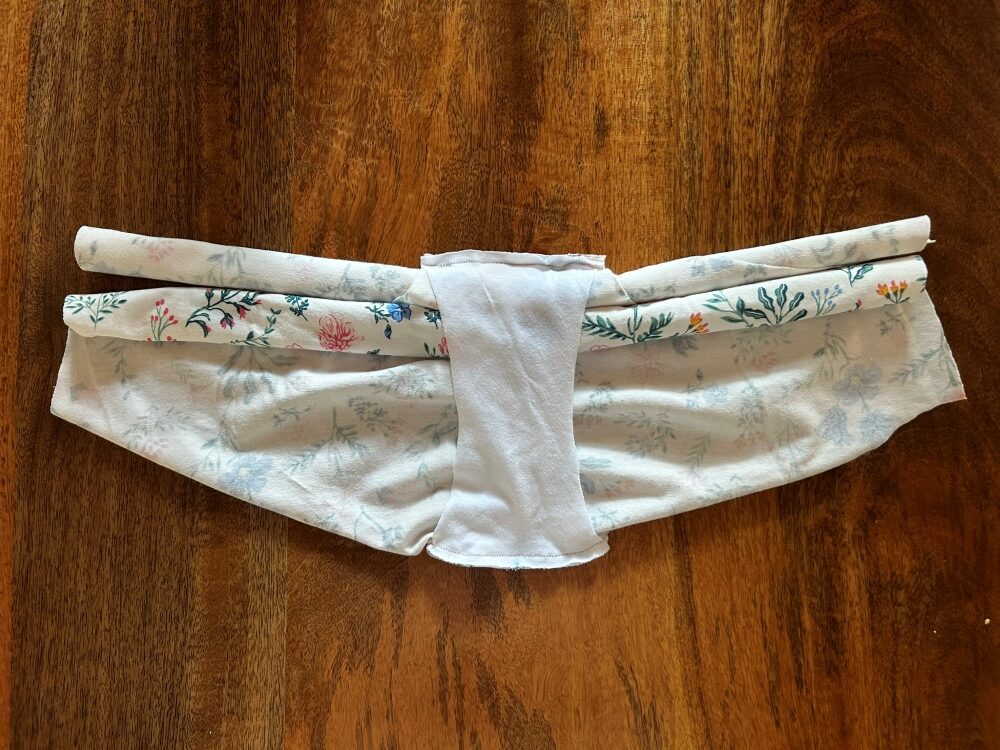 Gusset seam sewn together with front and back pieces still rolled inside