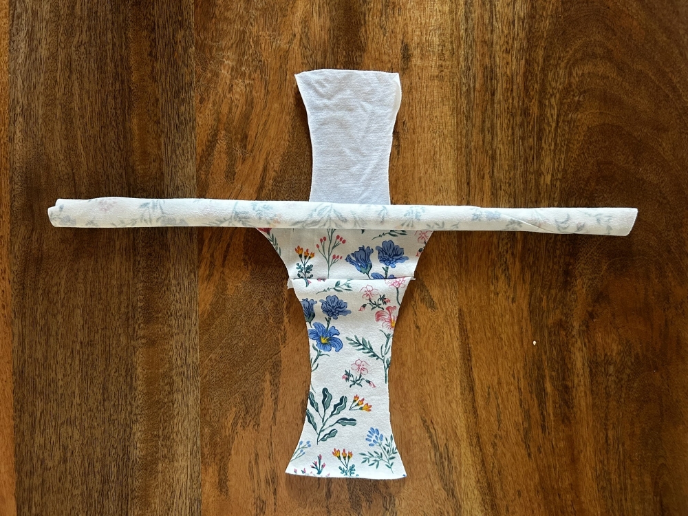 Front piece rolled up and placed between the gusset outer and lining pieces.