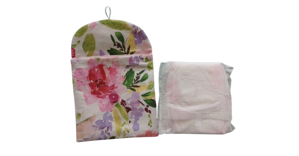 Floral fabric sanitary pad pouch with flap open, shown next to a folded sanitary pad.