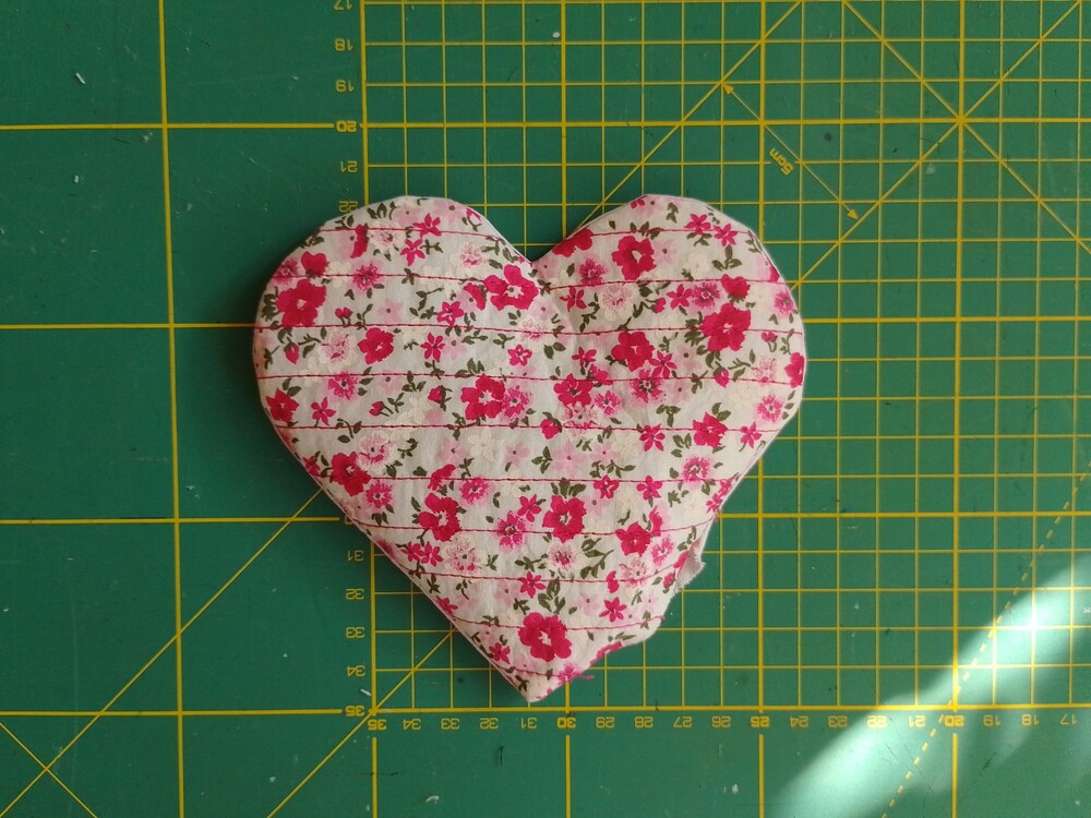 Fabric coaster turned right side out with floral fabric.