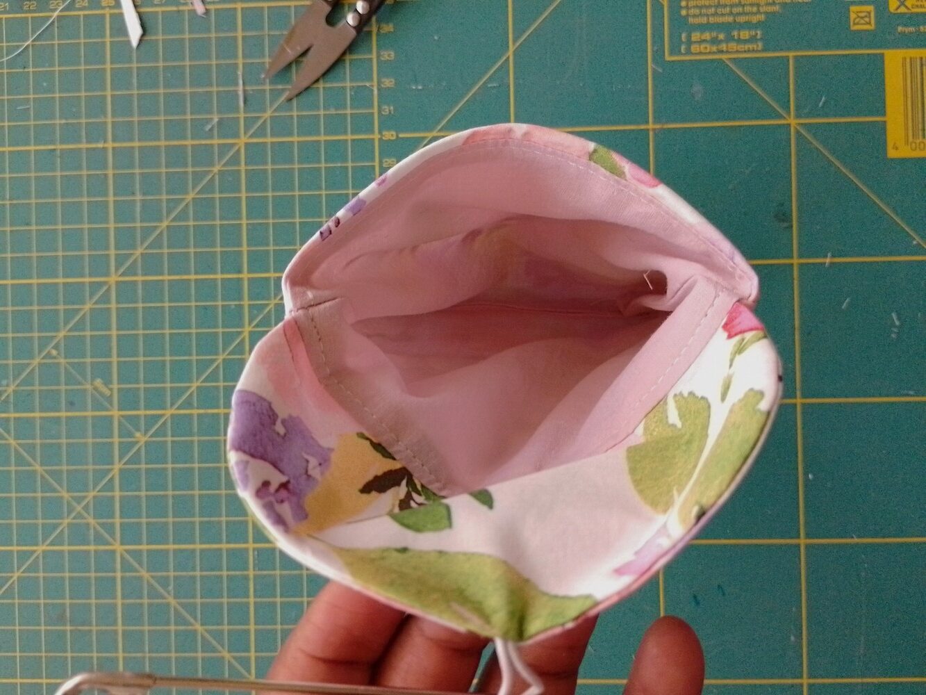 View of the inside of the pouch showing the pink lining.