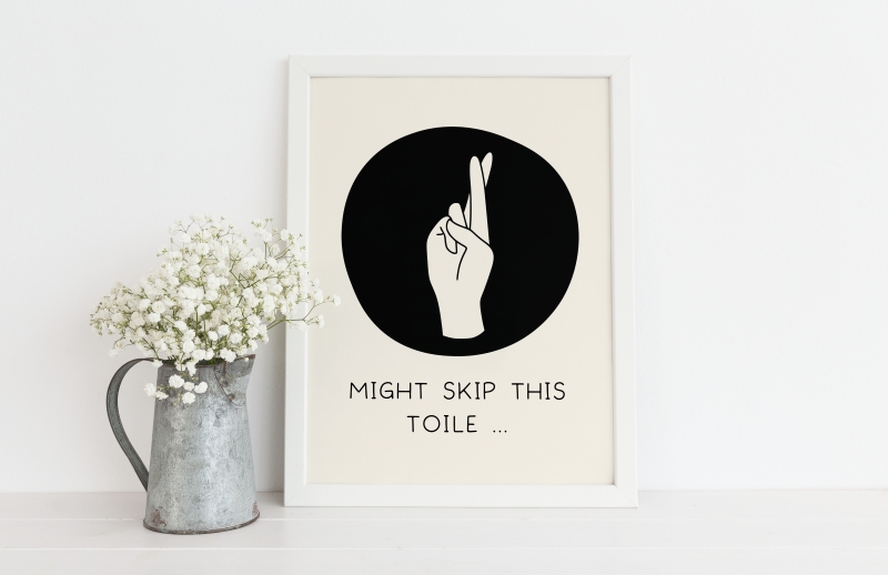 A framed art print featuring an illustration of a hand with fingers crossed and the phrase 'Might skip this toile'