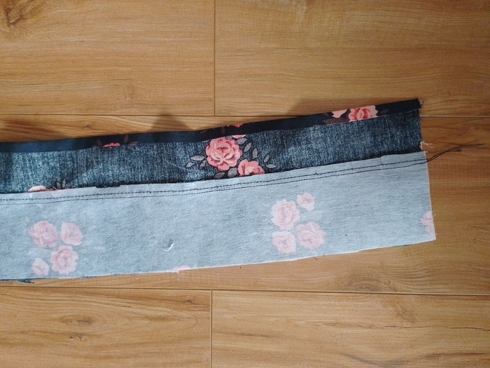 A close-up showing the bottom raw edge of the floral fabric folded over and pressed.