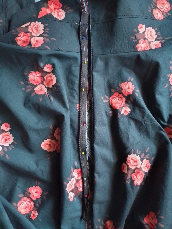 One of the invisible zipper pinned to the left skirt edge..