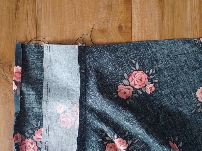 The waistband sewn to the skirt, showing the seam allowance pressed upwards towards the waistband.