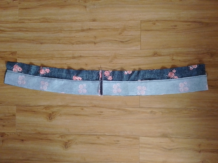 The wrong side of the open waistband, showing the seam allowances pressed towards the inner waistband and secured with understitching.