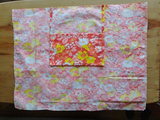 A pocket sewn onto the wrong side of a tote bag