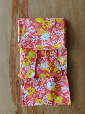 Tote bag folded once onto itself with straps exposed