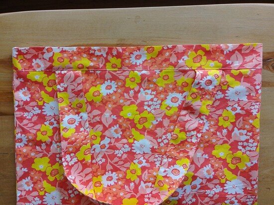 The casing of the tote bag flipped upwards with a visible line of stitching