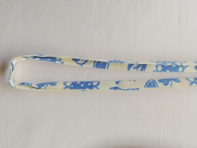 double folded drawstring in blue and off white printed fabric