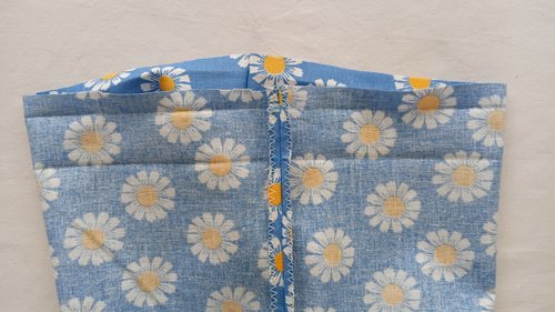 The inside of the bag showing a vertical seam pressed open with zigzag-finished edges.