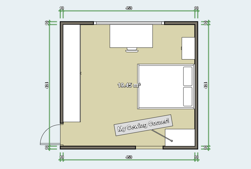Simple bedroom floor plan (19.45 m²) showing a bed on the right side, a desk with a computer along the top wall, a wardrobe on the left wall, a small cabinet in the bottom-right corner, and a labeled sewing corner near the lower center. The room has a door in the bottom-left corner and dimensions marked around the perimeter.
