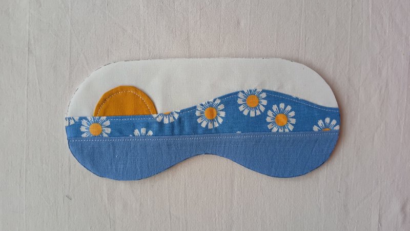 Sunrise appliqué sleep mask front cut into an eye mask shape.