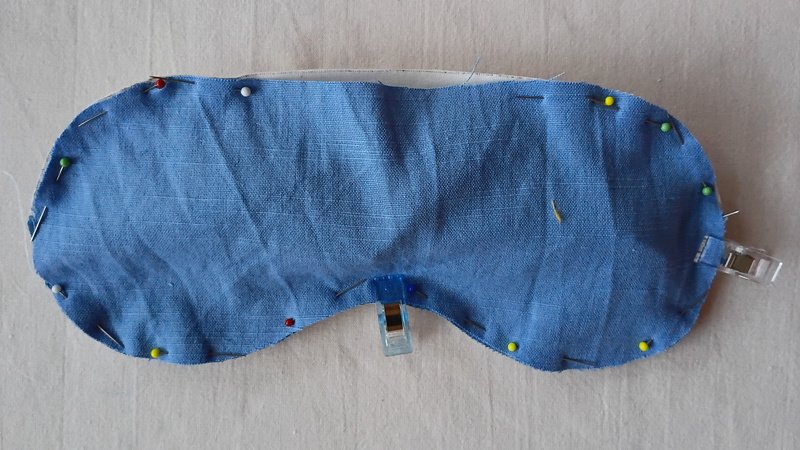 Sleep mask front and back pinned together with a gap left at the top