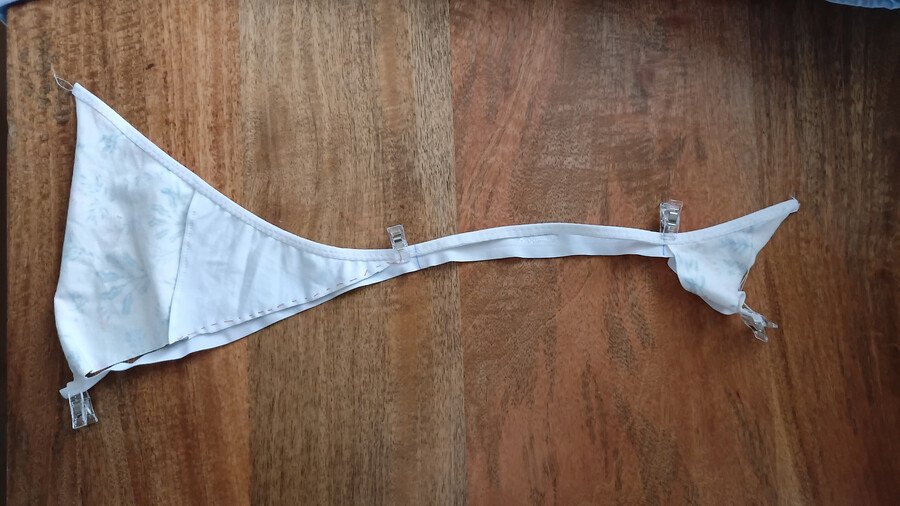 Fold-over elastic clipped to the front and back pieces with the side string section left unclipped.