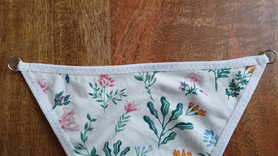 Rings sewn to the front piece of a g-string