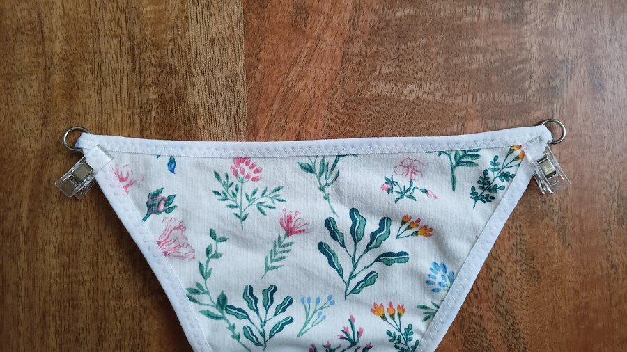 Rings clipped to the front piece of a g-string