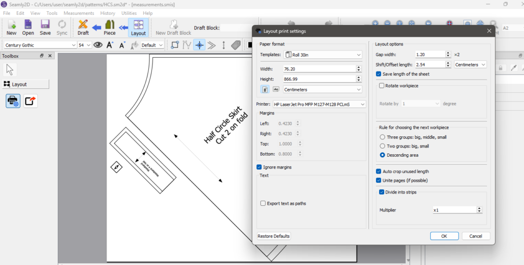 Seamly2D "Layout print settings" dialog with the Roll 30in template (76.20 by 866.99 cm), "Auto crop unused length" and "Divide into strips" checked, beside the half circle skirt and waistband pieces.