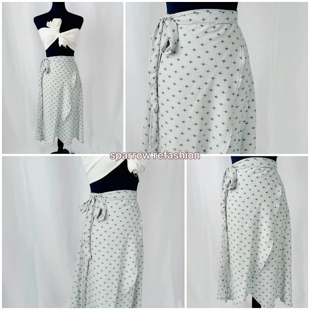 Pale gray wrap tulip skirt with a small blue print and side waist tie, shown from four angles on a dress form